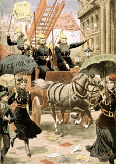 English suffragettes dressed in firemen walking down a londonian street