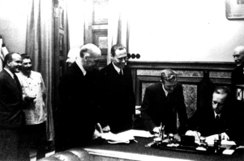 Signing of the Germano-Soviet Non-Agression Pact in Moscow. Ribbentrop signs. (Also seen: Stalin and Molotov)