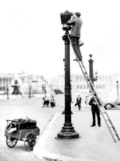 Paris. Installation of security blue lamps on public street lamps.