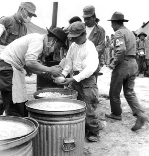 Distribution of rice at a U.N.O. camp in Korea