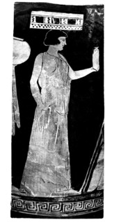 Painted vase. Young short-haired slave carrying a basket on her head