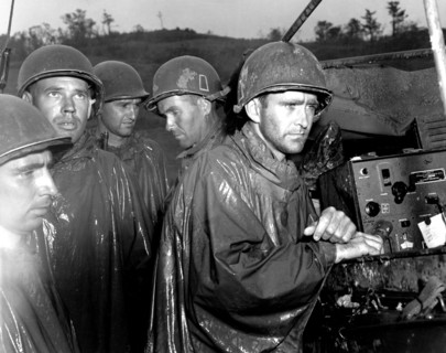US soldiers learning the German surrender on radio (May 1945)