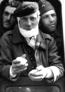 A french soldier and two of his comrades, coming from Dunkirk, receive a snack after their landing in Great Britain