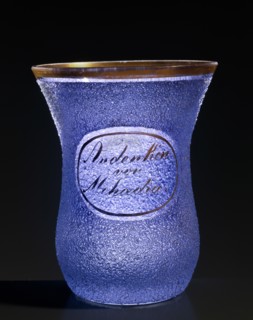 Clear glass souvenir glass with blue glass bead applications (Glasperlen)
