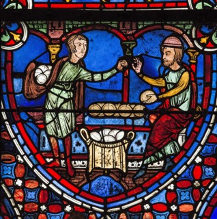 Un homme achète du pain au boulanger (vitrail de Chartres)