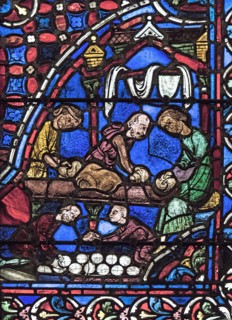 Les boulangers façonnent les boules de pain (vitrail de Chartres)