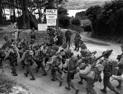GI's and their equipment on their way to the landing crafts (England-June 3,1944)