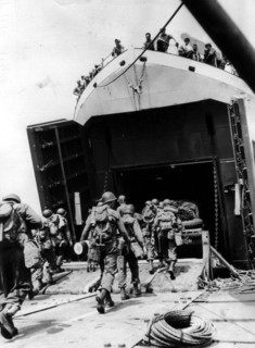 U.S combat enginner unit march aboard a landing ship (England) June 1944