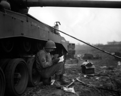 American corporal leaning against a tank, 1945