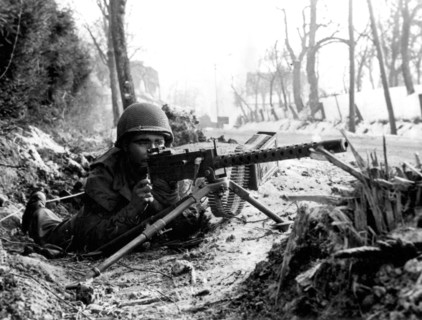 U.S machine gunner guards road in France, Fall 1944