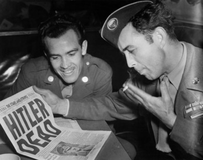 U.S.  soldiers read the Death of Hitler in Stars and Stripes Newspapers in Paris, May 2, 1944
