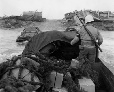 A  U.S . MP's drives a " duck" in Le Havre harborn, January 25, 1945