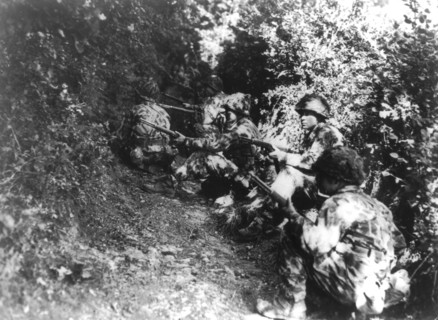 U.S. soldiers ready for action near  Pont Brocard, Summer 1944