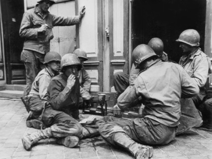 Quick meal in Cherbourg for U.S. troops, June 28, 1944