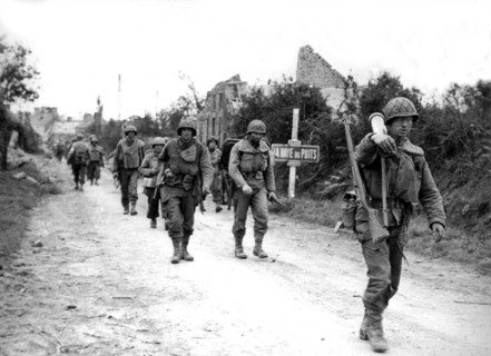 American troops leave the French town of La Haye du Puits and advance to Lessay (France) July 1944