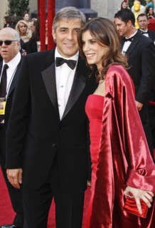 US actor George Clooney and his girlfriend Elisabetta Canalis arrive on the red carpet during the