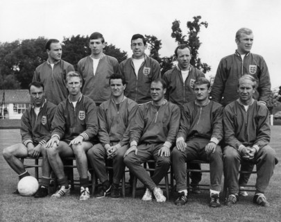 The players of the English national soccer team pose for a group photo on a pitch at  Wembley