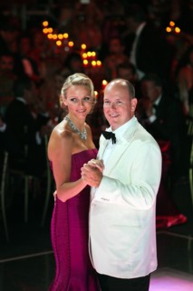 Prince Albert II of Monaco and his wife, Princess Charlene of Monaco, dance at the 63rd Red Cross