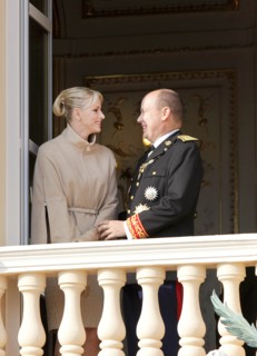 Prince Albert II of Monaco and his wife Princess Charlene stand on the balcony of the palace of
