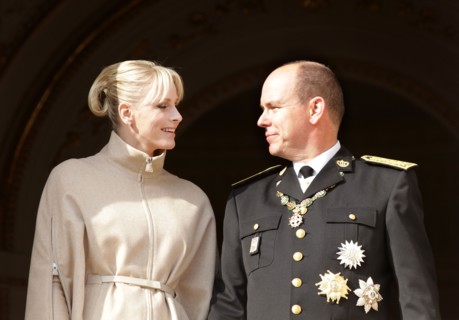 Prince Albert II of Monaco and his wife Princess Charlene stand on the balcony of the palace of