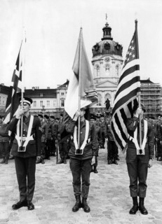 Flag bearers during a military parade at the 'Armed Forces Day' in Berlin