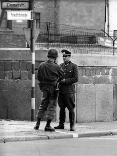 US soldier and People's Police officer standing face to face