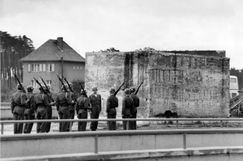 US army observes the plinth of a Soviet tank monument