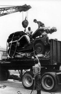 US soldiers load a jeep