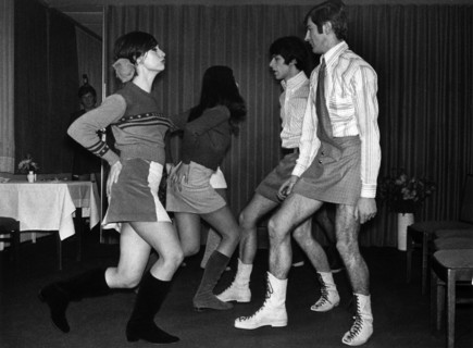A group of young models, male and female, present themselves in mini skirts on 6 December 1966 in