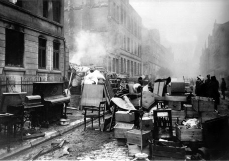 (dpa files) - People try to save their belongings from their destroyed houses in the Marienstrasse
