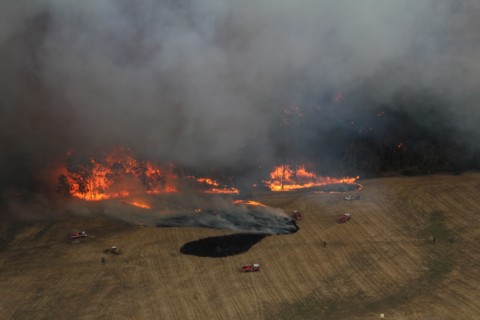 Photo taken on Dec. 20, 2019 shows fire trucks working at Lexton bush fire site in western Victoria, Australia