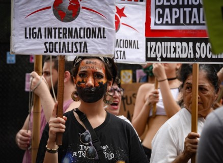 Argentina, Buenos Aires: A demonstrator who has symbolically painted a kangaroo running away from the fire on her face is taking part in a protest against climate policy in front of the Australian Emb...