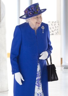 Queen Elizabeth II walks through the Garden Lobby at the Scottish Parliament in Edinburgh ahead of