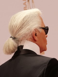 German fashion designer Karl Lagerfeld (C) arrives for the Bambi award in Wiesbaden, Germany, 10