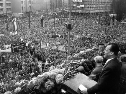 View of the demonstrating crowd while governing mayor of Berlin Willy Brandt (r) gives a speech on the 1st of May in 1958.