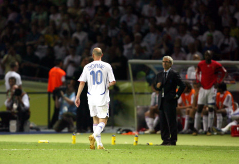 French Zinedine Zidane (L) walks off the pitch after being red-carded next to his coach Raymond