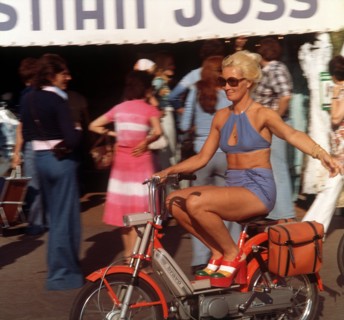 Where the rich and beautiful go on holiday: A woman, lightly dressed for summer and wearing