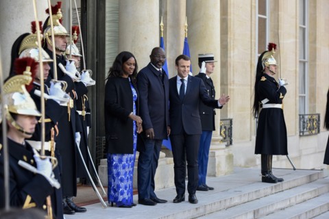 French President Emmanuel Macron and the newly elected visiting Leberian President George Weah pose for photos at Elysee Palace in Paris, France on Feb. 21, 2018.