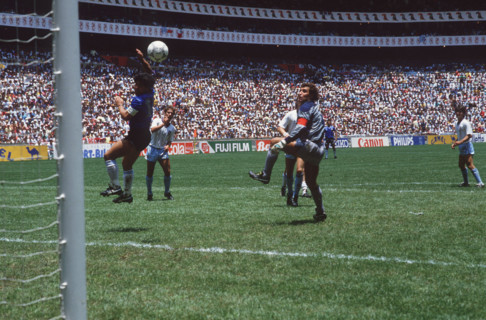 Diego MARADONA, Argentina, is scoring the legendary "Hand of God" goal against England during the