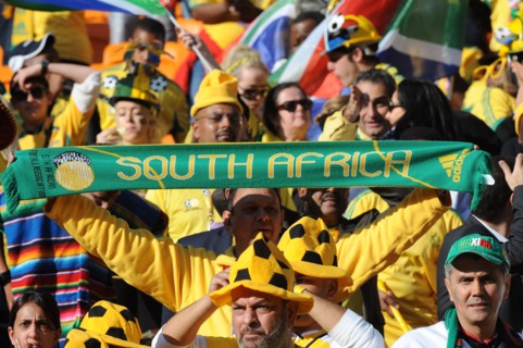 Fans celebrate during the opening ceremony of the 2010 FIFA World Cup at Soccer City stadium in