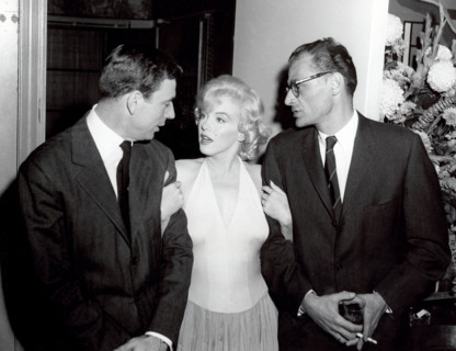 A happy trio at the Monroe cocktail party left to right Yves Montand, Marilyn Monroe and her