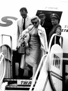 Marilyn Monroe and her husband Arthur Miller arrive at London airport. 14th July 1956