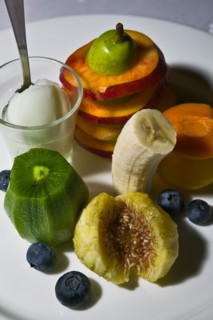 A dessert with fruit and icecream