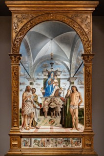 “Enthroned Madonna with infant Jesus  among Saints John the Baptist, Bartholomew, Agustine, Sebastian and three angels playing music”, by Bartolomeo Montagna