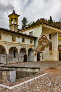 Clusone, Oratory of Disciplini or St. Bernardino, façade: frescoes with the Triumph of Death on