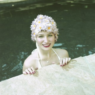 Woman in Pool Wearing Floral Cap