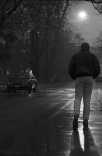 Man Walking Down Moonlit Street, Rear View