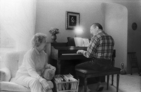 Elderly Couple Singing and Playing Piano