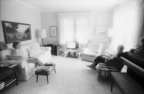 Elderly Couple Sitting in Living Room