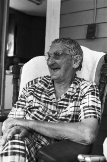 Elderly Woman Sitting on Porch